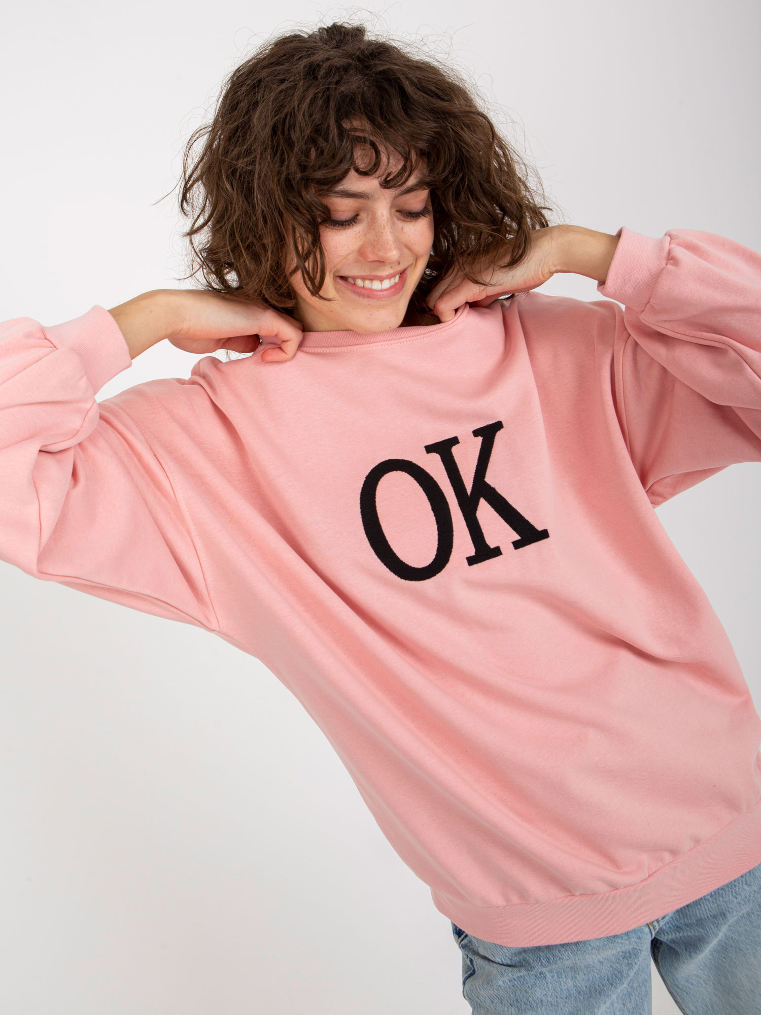 Wholesale light pink loose sweatshirt without a hood with an inscription.