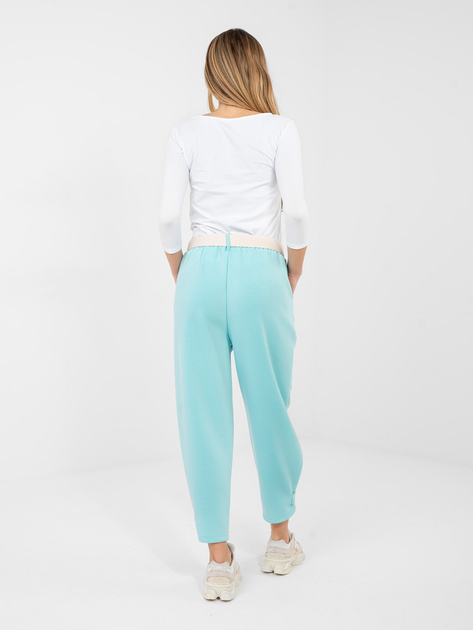 Miętowe dresowe spodnie z kieszeniami