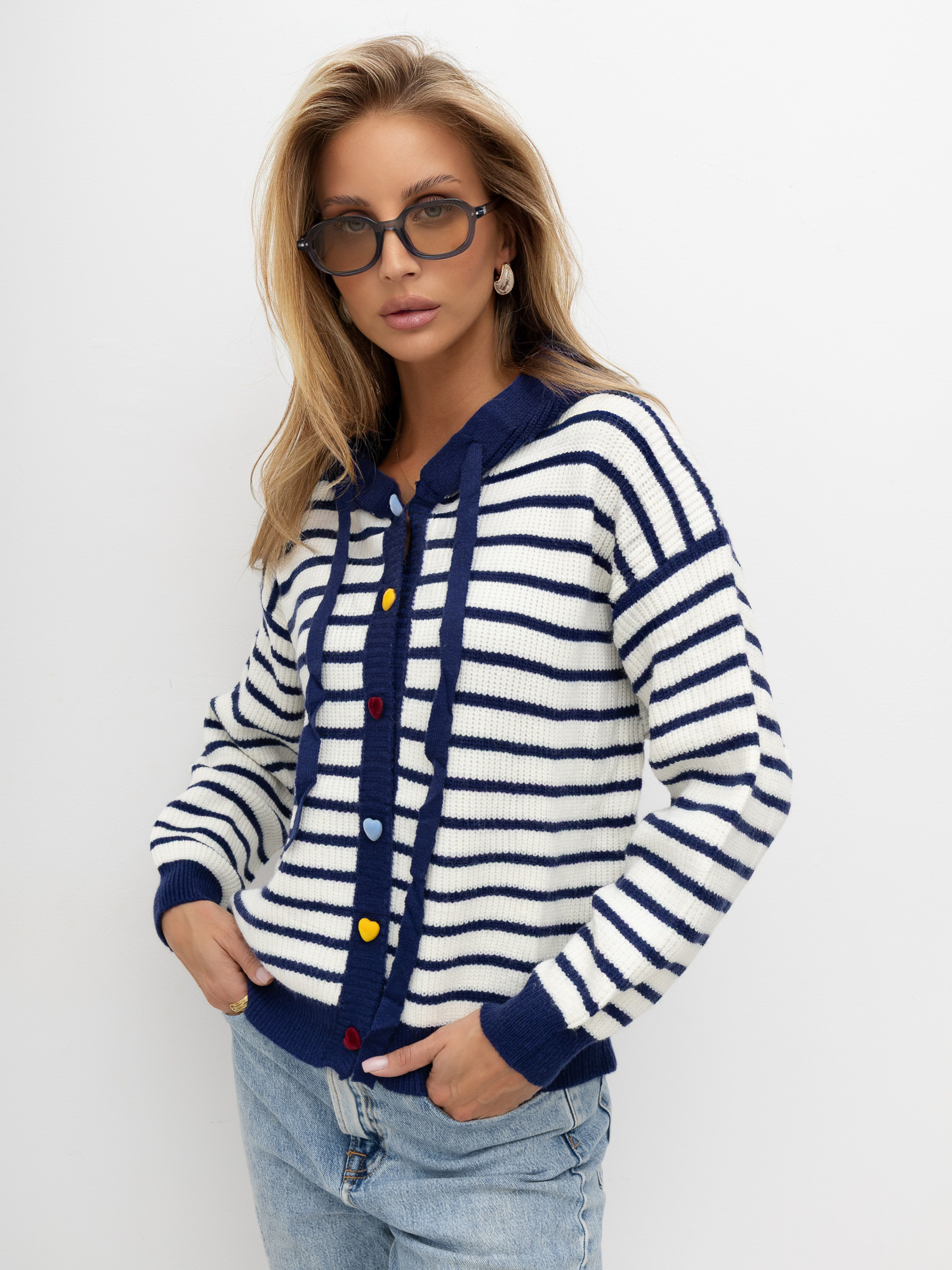 Navy sweater with decorative heart-shaped buttons.