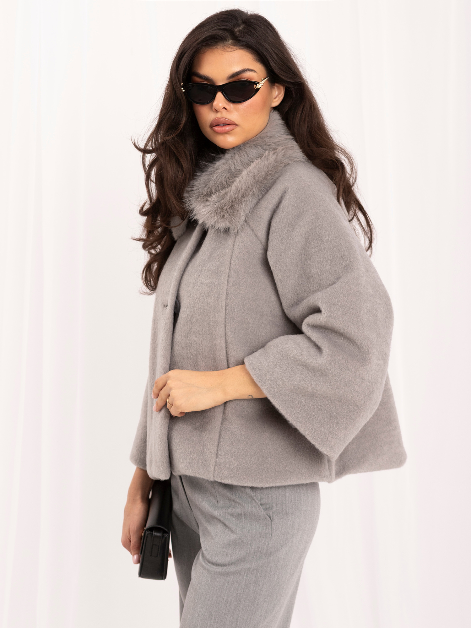 Gray trapeze coat with wide sleeves.