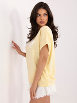 Jasnożółta bluzka z kontrastowym napisem RUE PARIS 