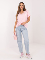 Jasnoróżowa damska bluzka oversize z krótkim rękawem