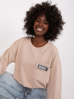 Hurt Beżowa krótka bluzka na co dzień ze ścigaczem