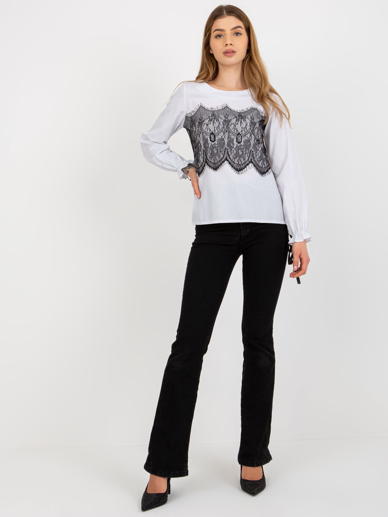 Hurt black and white polka dot blouse with a tie.