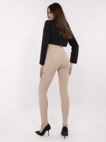Beżowe damskie legginsy z ozdobną naszywką