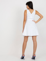 Hurt White flared denim dress with a tie.