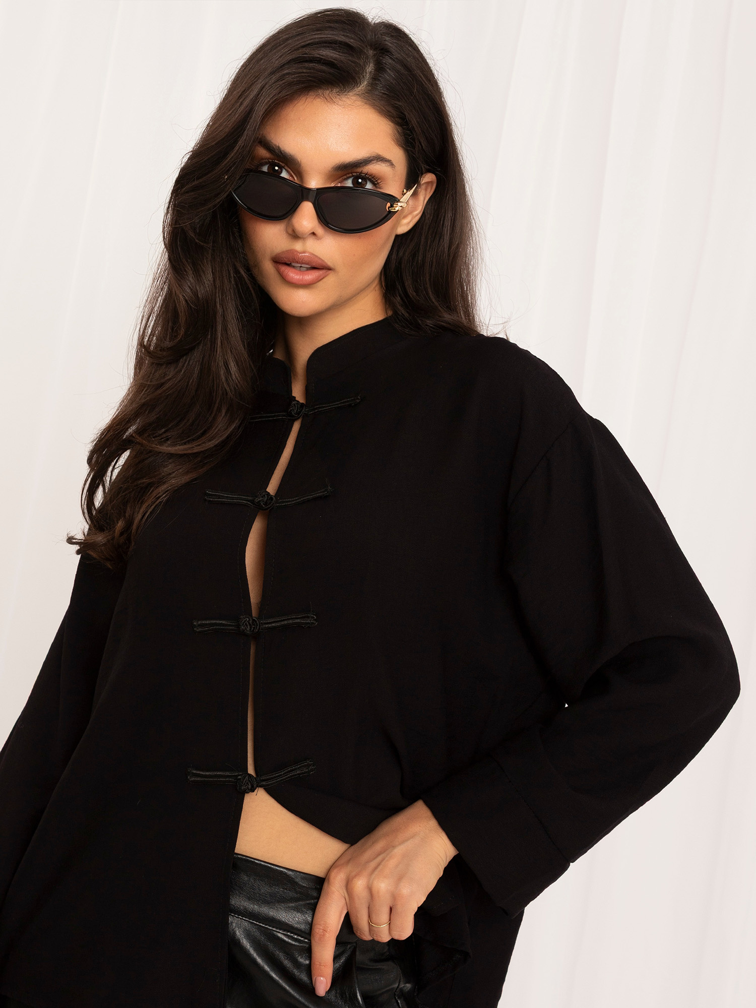 Black shirt blouse with Chinese fastening.
