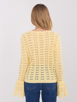 Jasnożółty sweter z ozdobnymi guzikami