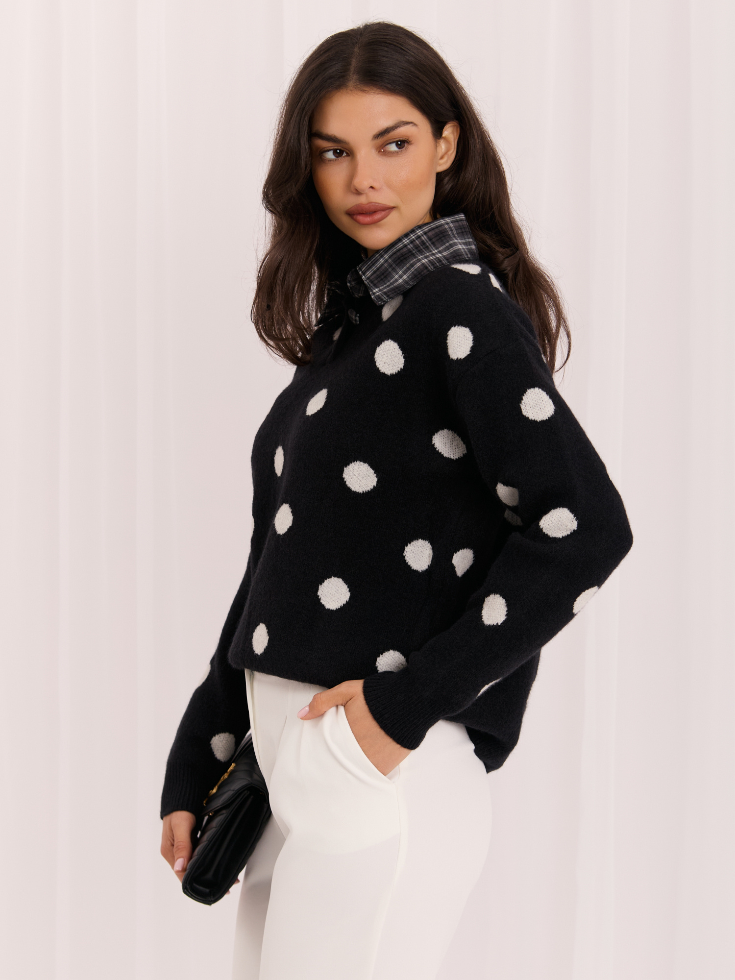 Black women's oversized polka dot sweater.