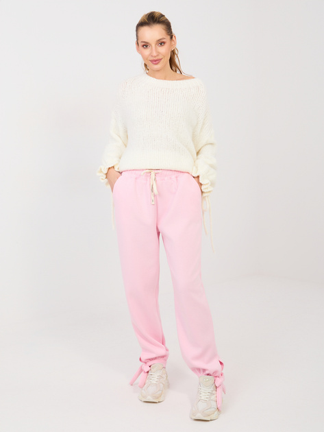 Jasnoróżowe dresowe spodnie wiązane w kostce