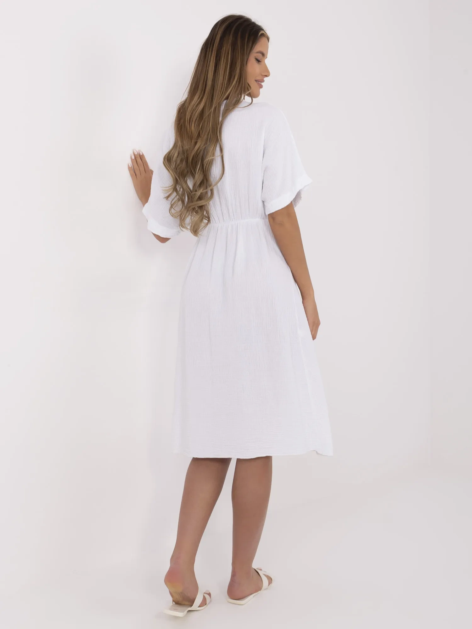 White muslin dress with short sleeves.