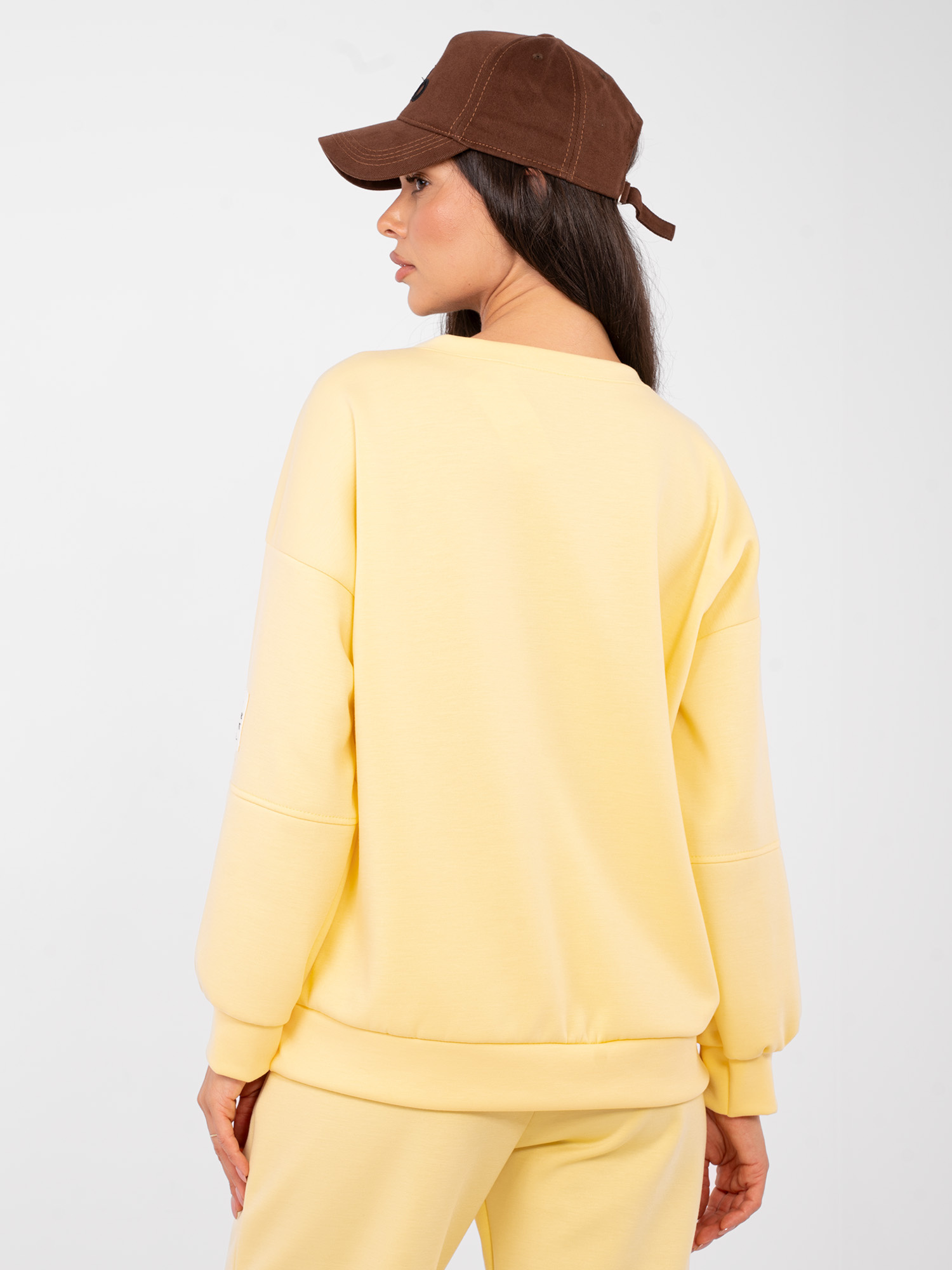 Light yellow tracksuit set with oversized sweatshirt.