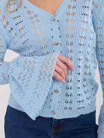 Light blue openwork sweater with buttons.
