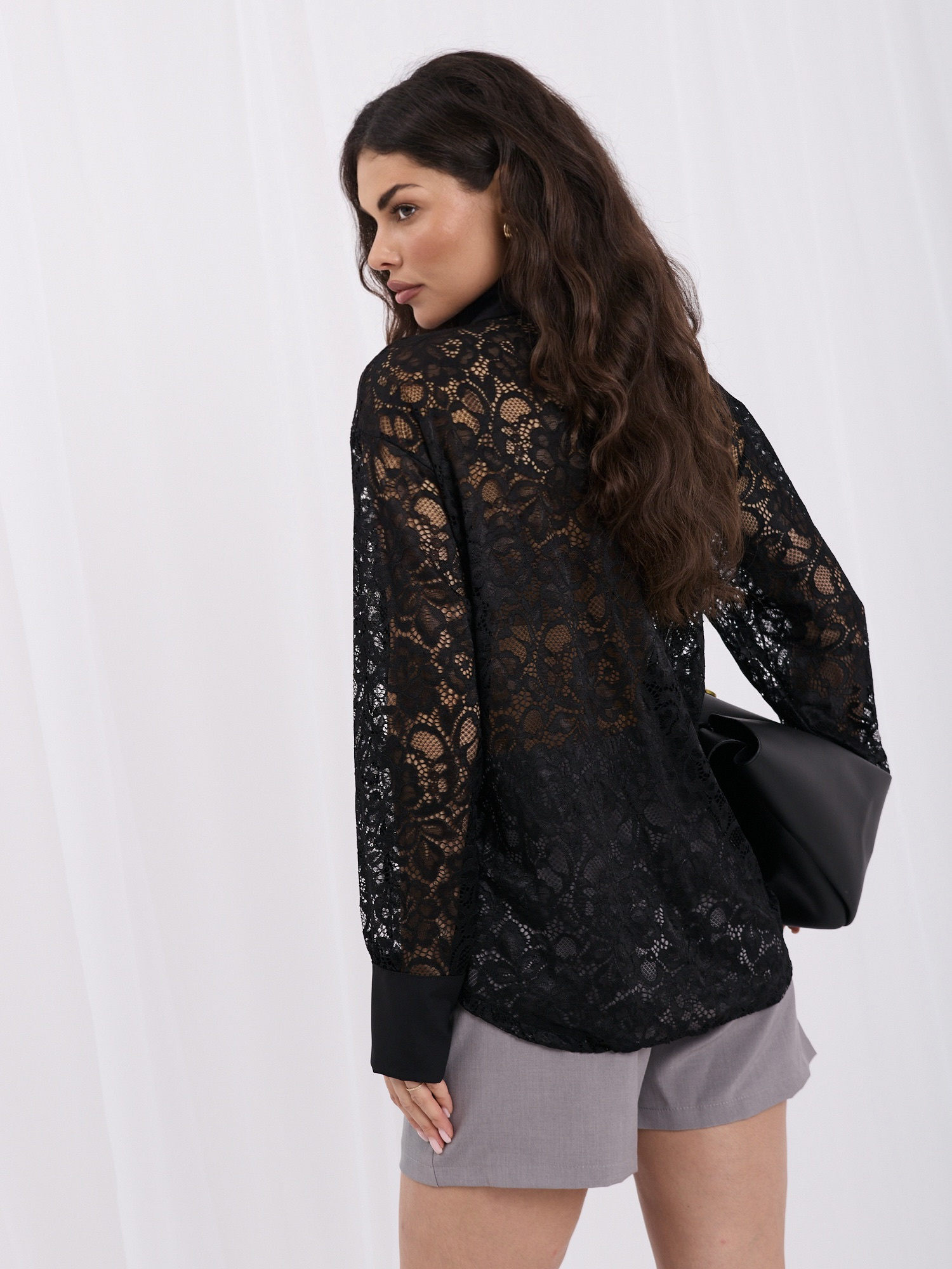 Black lace shirt with a collar.