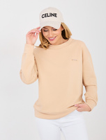 Beżowa bluza oversize z ozdobną naszywką