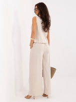 Light beige elegant set with wide trousers.