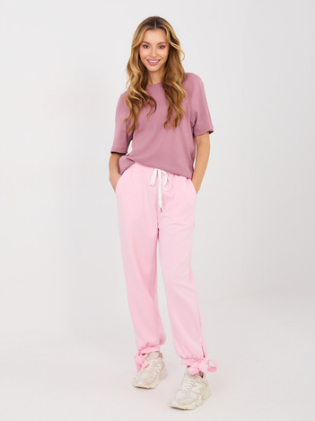 Jasnoróżowe dresowe spodnie z kokardkami