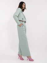 Pistachio suit with pleats on the pants.