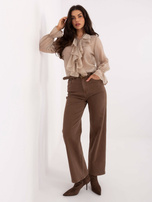 Beige transparent shirt with ruffles.