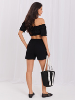 Black short muslin shorts.