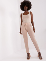 Hurt Beżowe damskie spodnie dresowe z lampasami