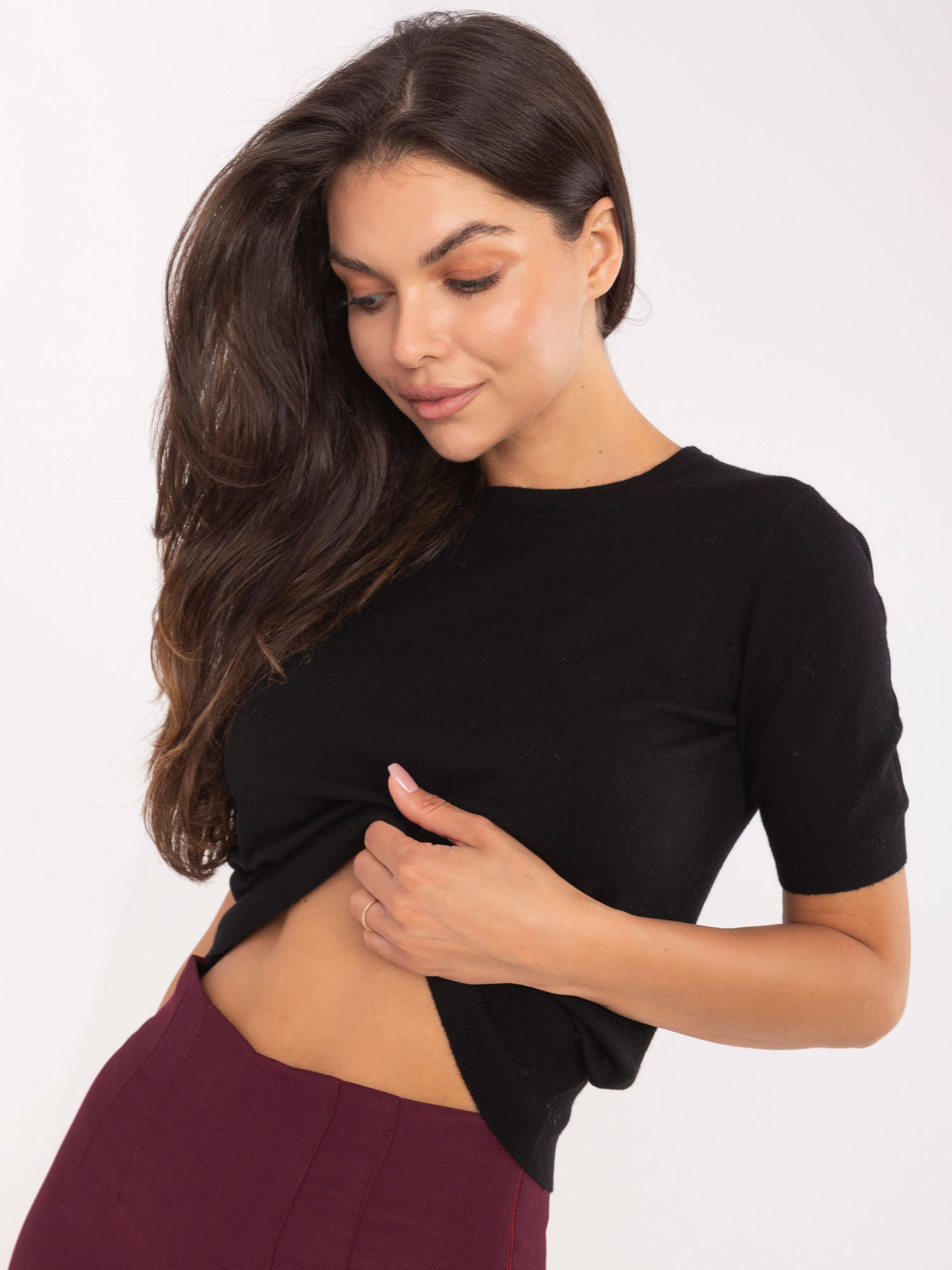 Black classic sweater with ribbed cuffs.