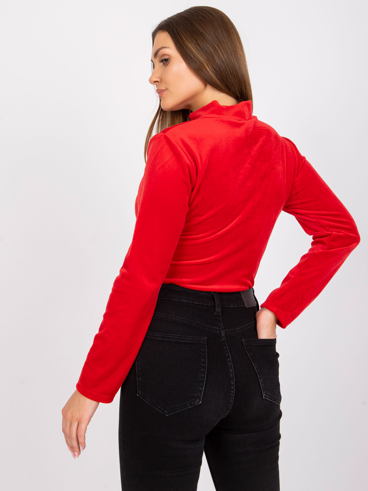 Red velour blouse with a cutout at the neckline of Kigali