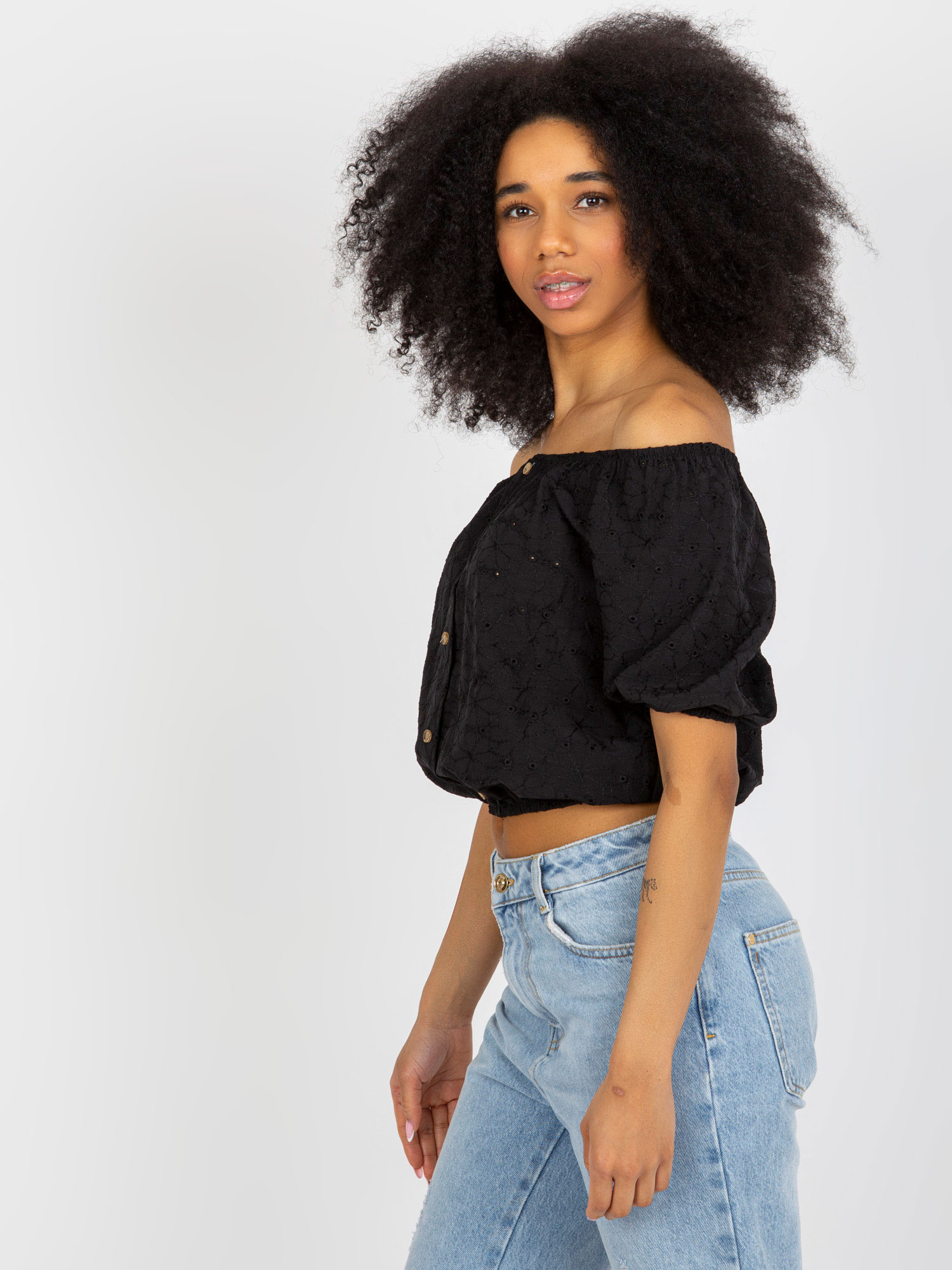 Wholesale Black perforated off-shoulder blouse made of cotton.