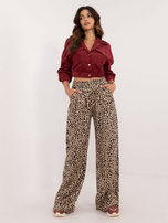 Hurtownia Beżowo-czarne długie spodnie w panterkę