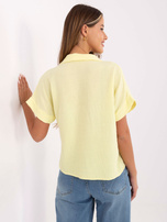 Light yellow muslin short-sleeved shirt.