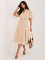Beżowa rozkloszowana sukienka z falbaną