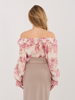Pink elegant off-the-shoulder blouse with flowers.