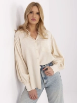 Light beige oversized shirt with puff sleeves.