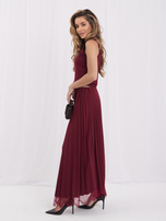 Burgundy maxi skirt with decorative finish.
