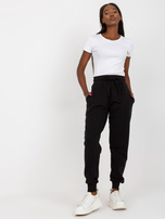 Hurtownia Czarne dresowe spodnie basic z kieszeniami 