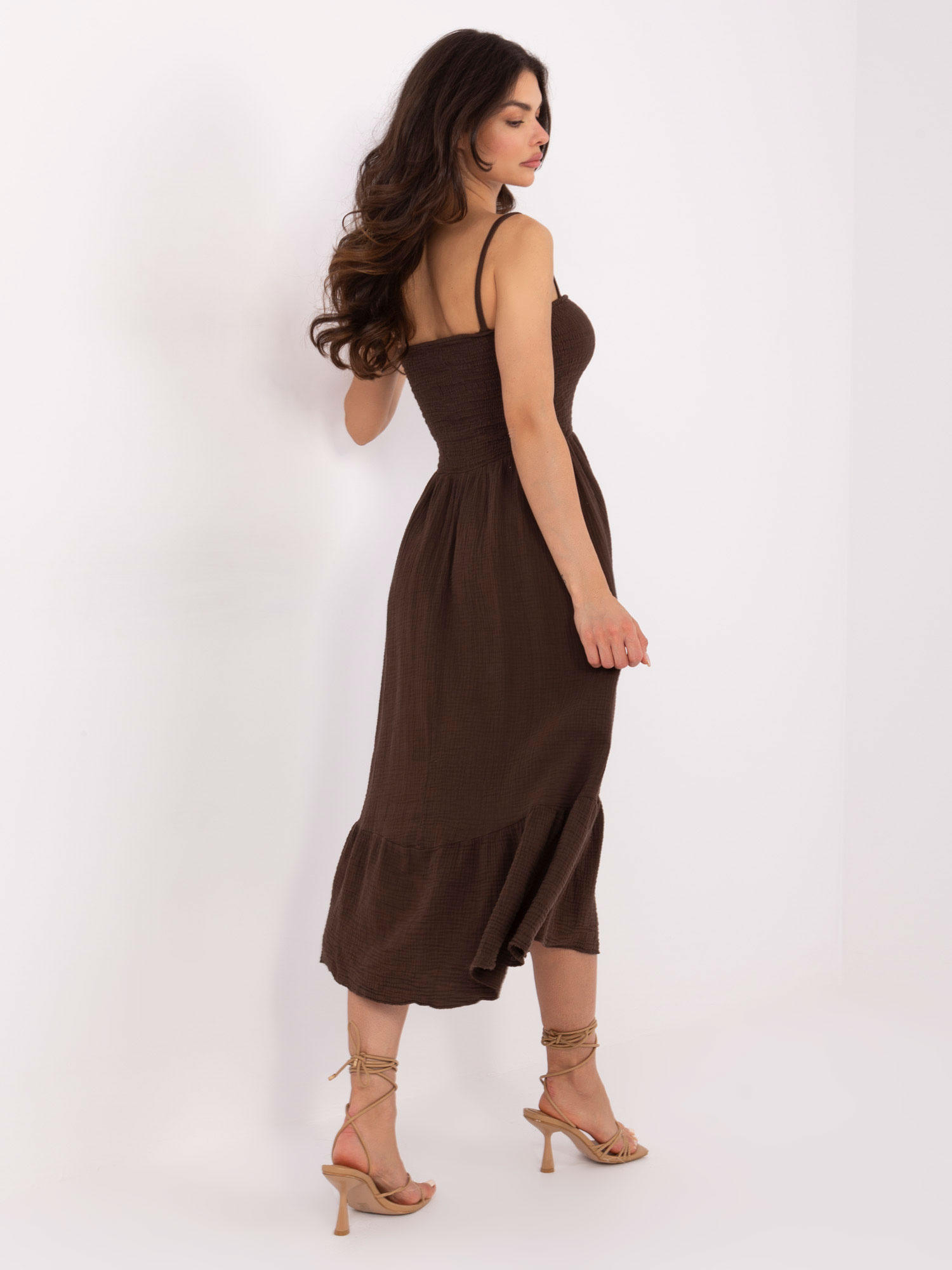 Dark brown muslin dress with buttons.