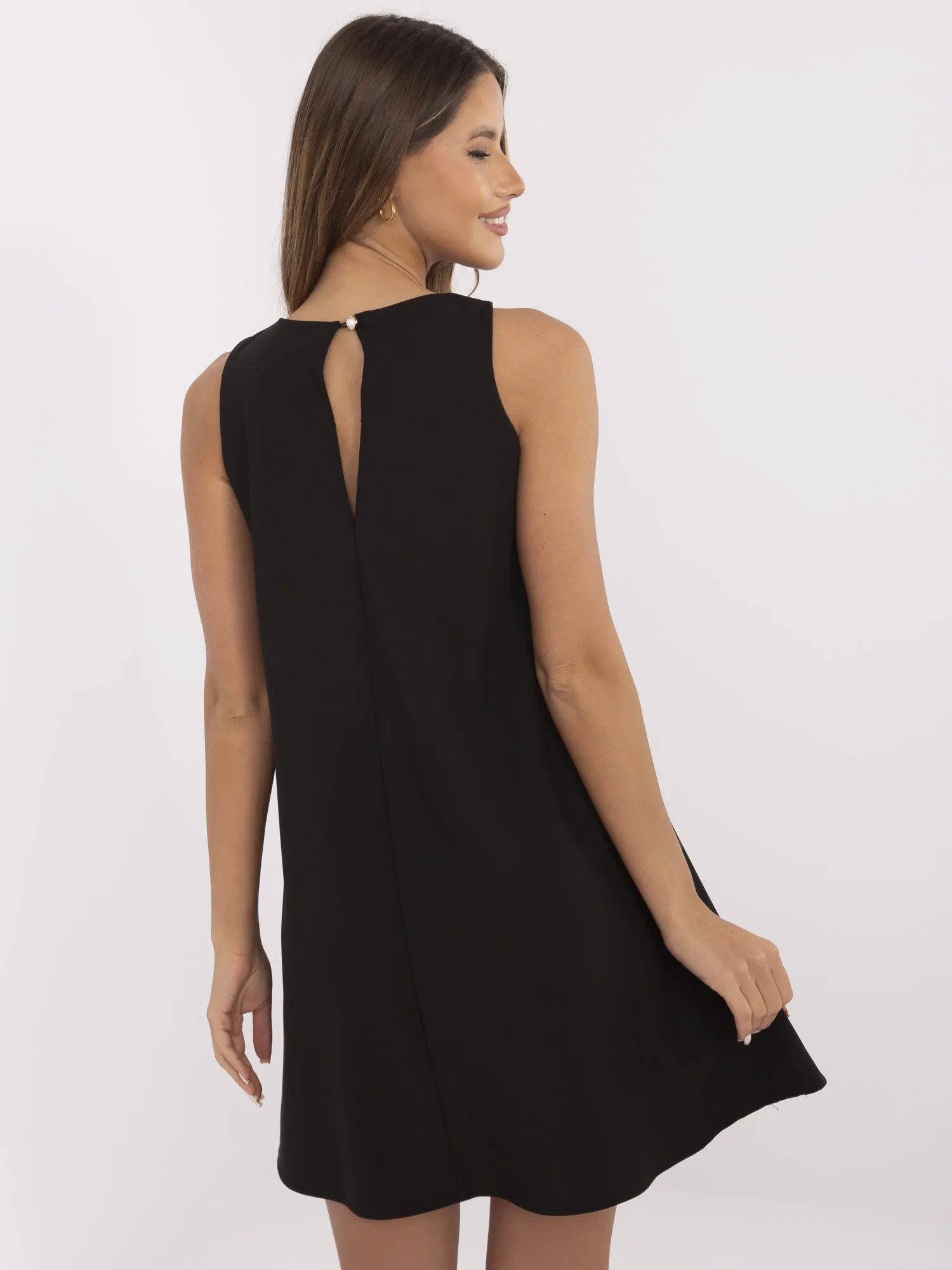 Black trapeze sleeveless dress.