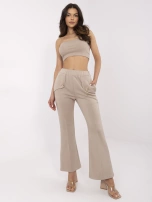 Beżowe dresowe spodnie z rozszerzanymi nogawkami