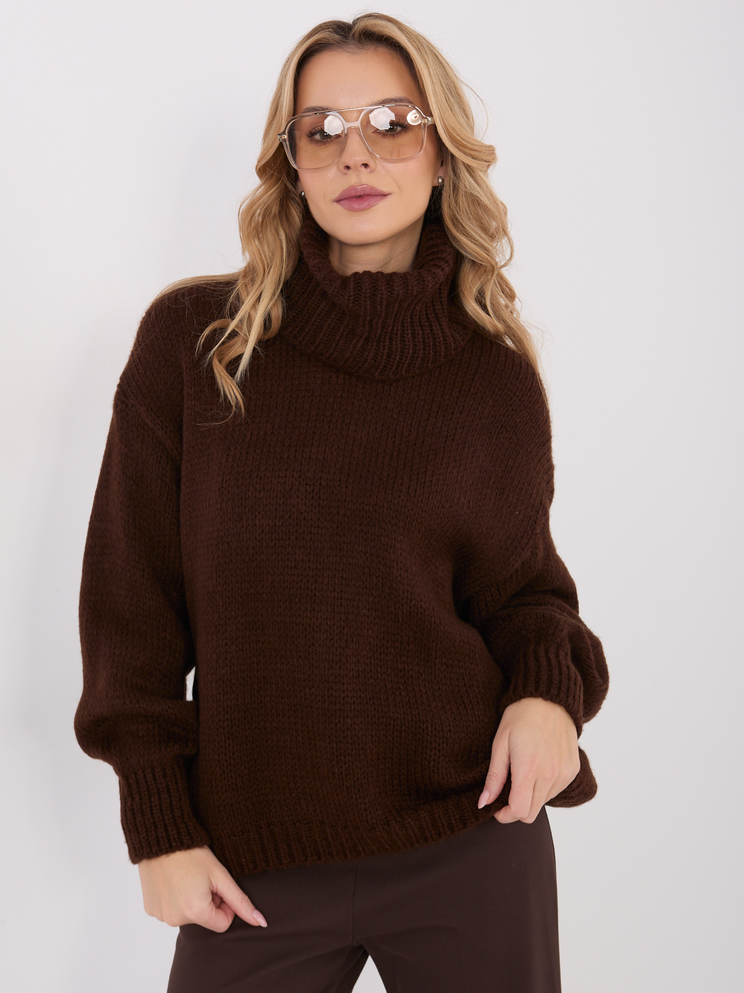 Dark brown women's oversized turtleneck sweater.