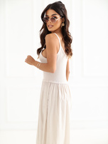 Light beige flared dress with straps.