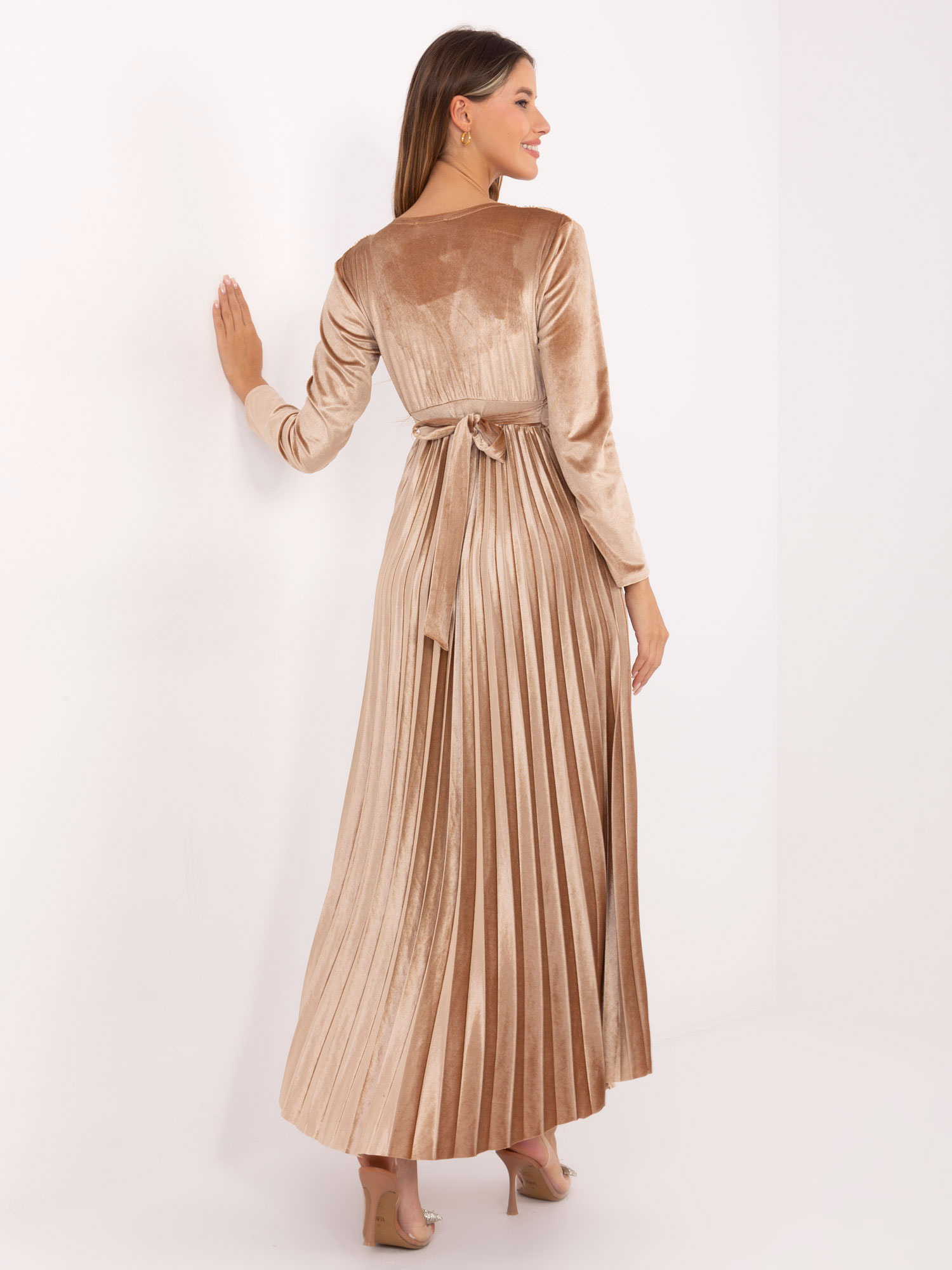 Beige evening dress with sequins.