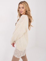 Jasnobeżowy długi sweter z koronkowym dołem