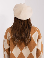 Hurtownia Jasnobeżowy sweter damski z aplikacją