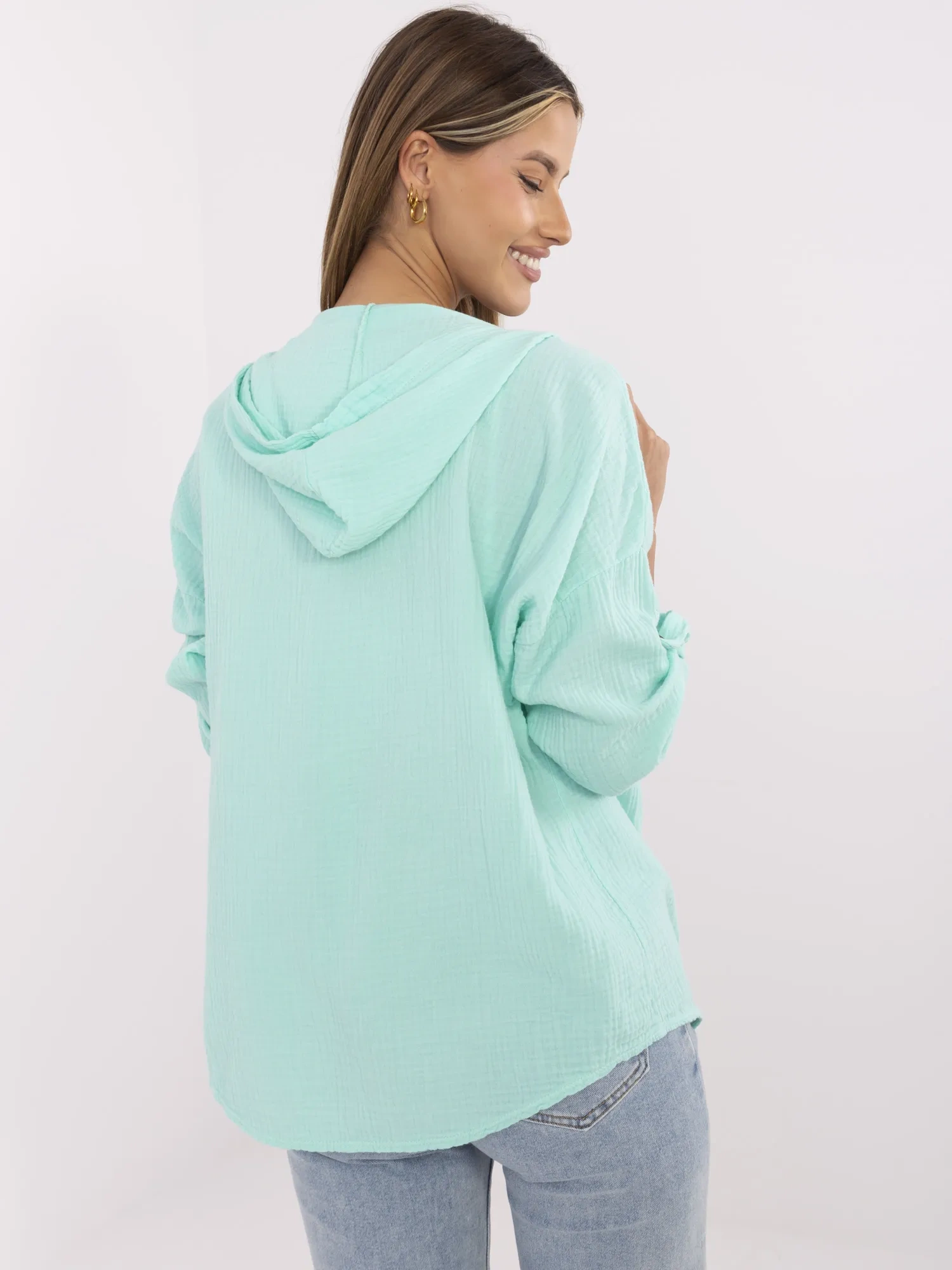 Mint green button-up women's shirt made of muslin.
