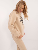 Hurtownia Beżowa damska bluza oversize z printem
