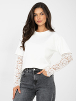 Ecru women's blouse made of soft material.