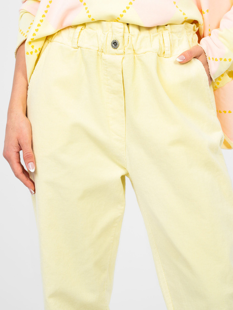 Pastelowe żółte sztruksowe spodnie z kieszeniami