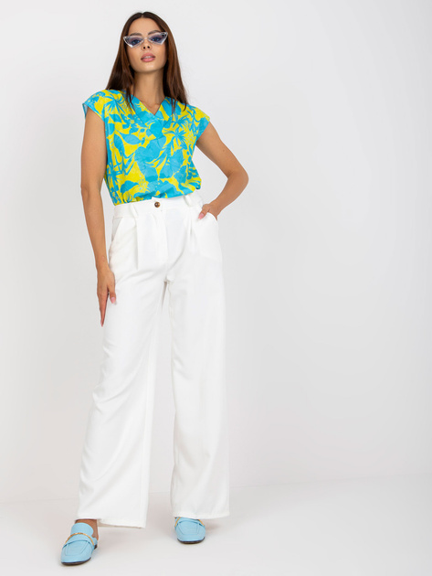 Białe szerokie spodnie garniturowe z kieszeniami