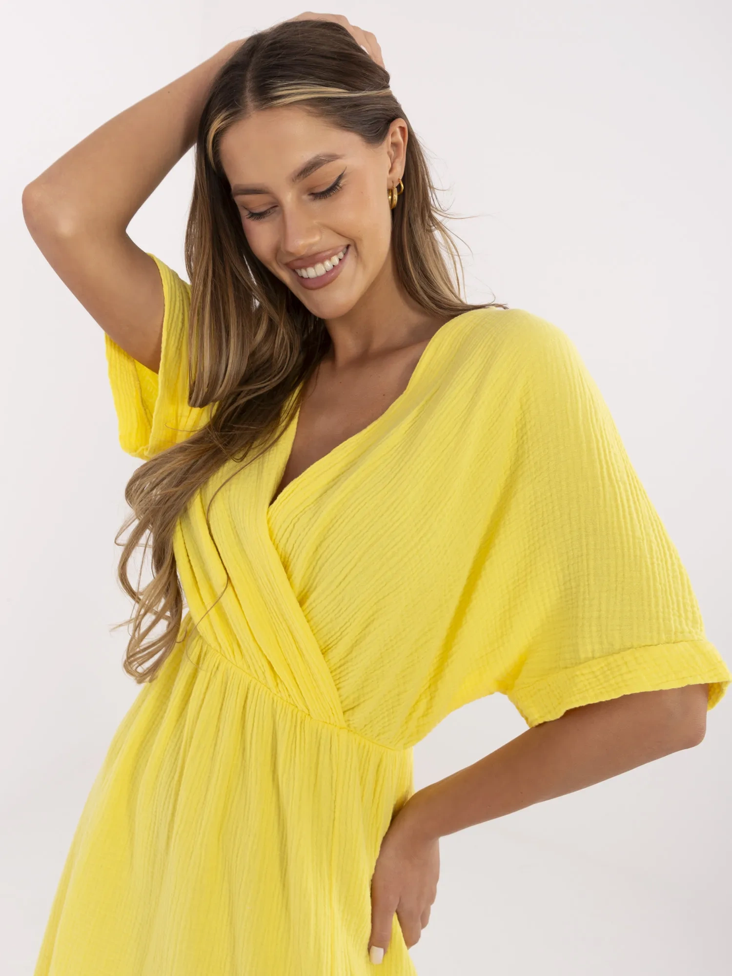 Yellow summer women's dress made of muslin.