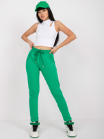 Green high-waisted cotton sweatpants.